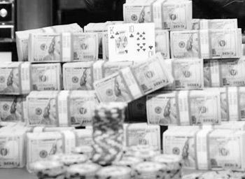 a big stack of dollar piles and chips in black and white